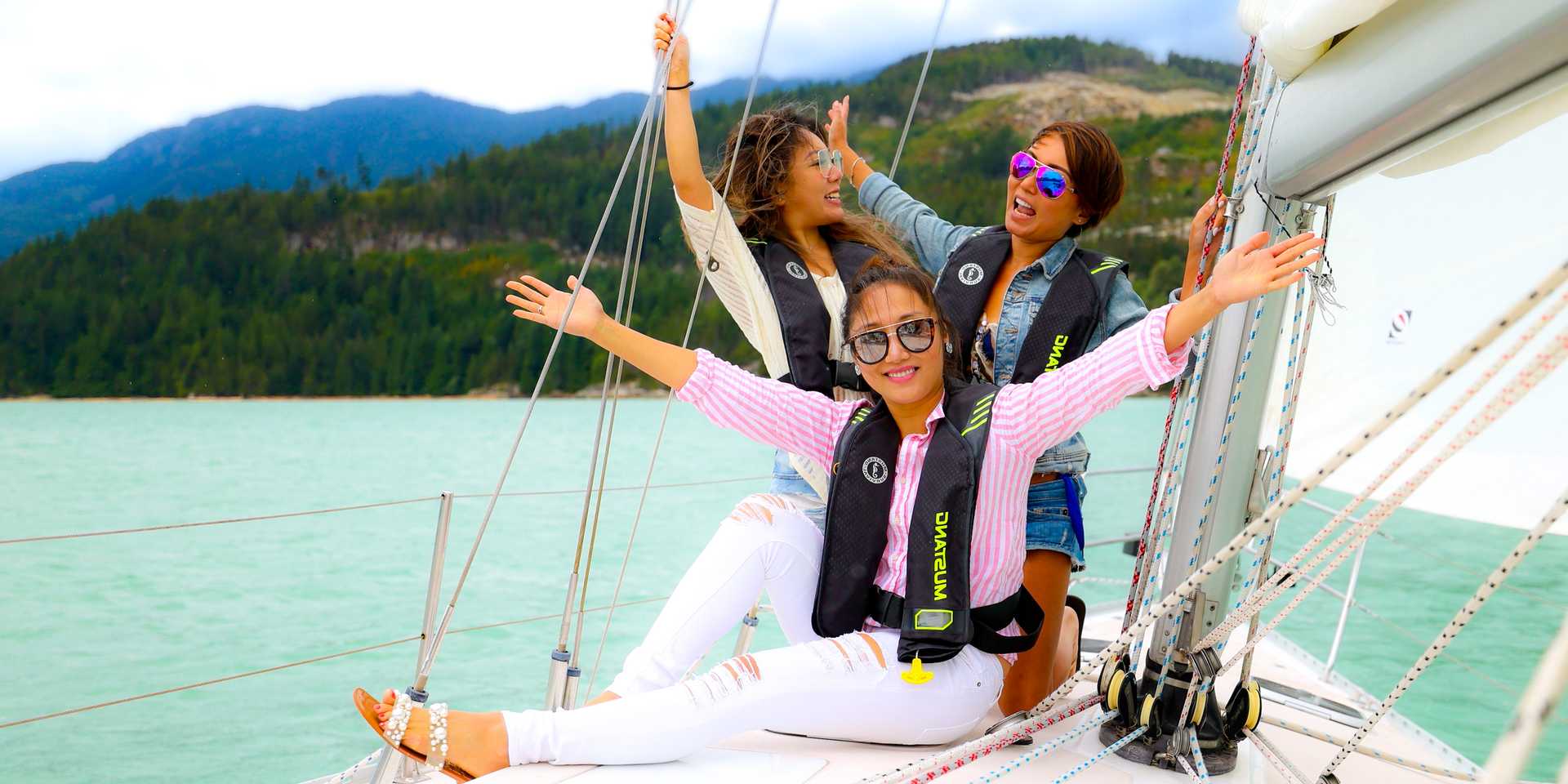 Pretty ladies celebrating a birthday on a sailboat